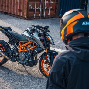 Rider standing near KTM 390 Duke
