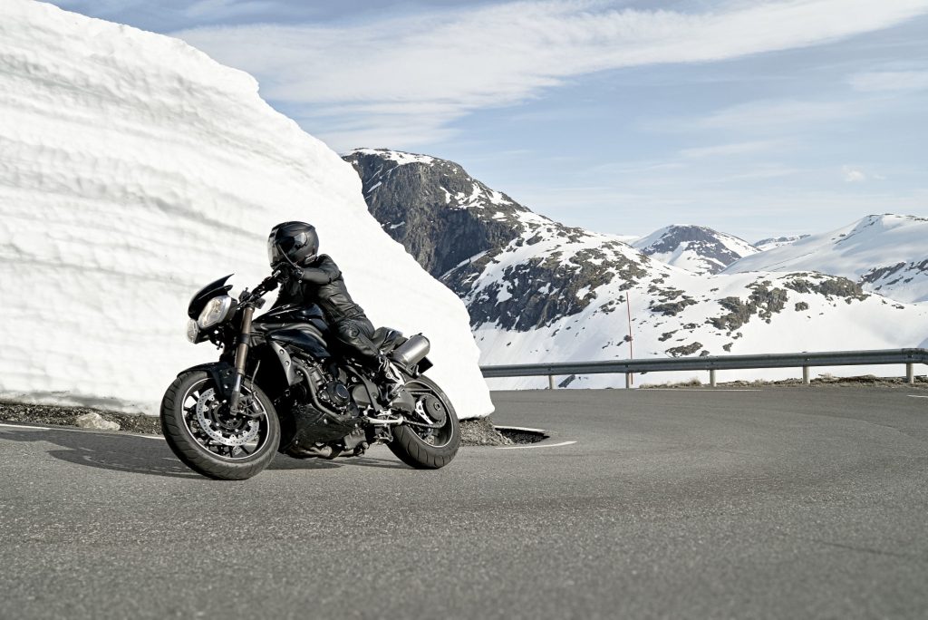 Riding on a dry highway in winter in the mountains