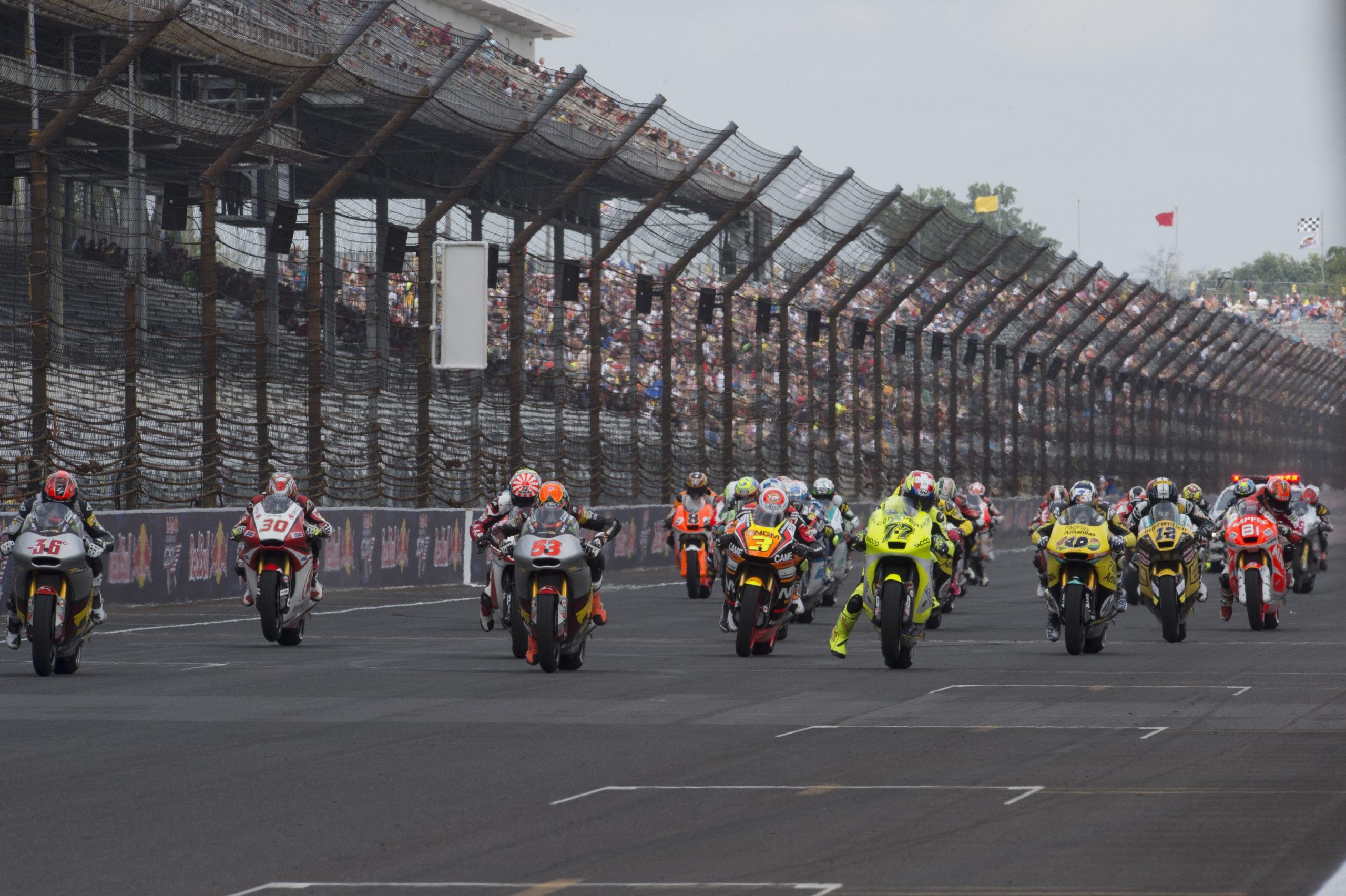 Motorcycle racers on the MotoGP racetrack