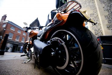 Close up of rear tyre on orange motorcycle